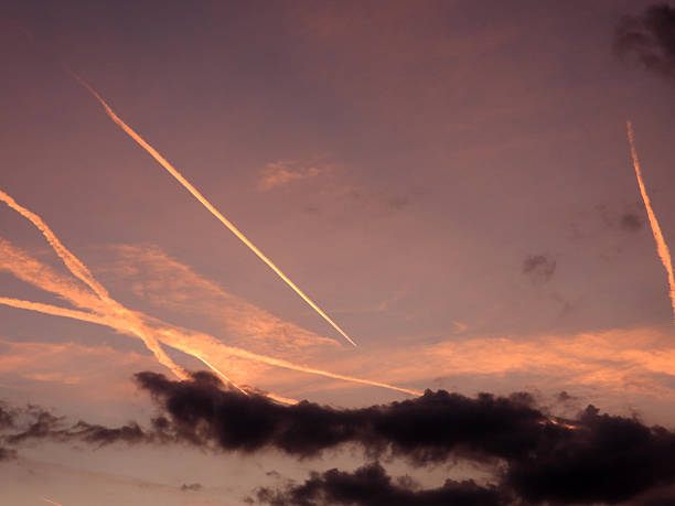 sunset sky with lines left after the airplanes