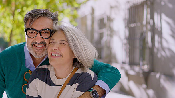 istock Senior couple embracing outdoors and smiling 2249935786