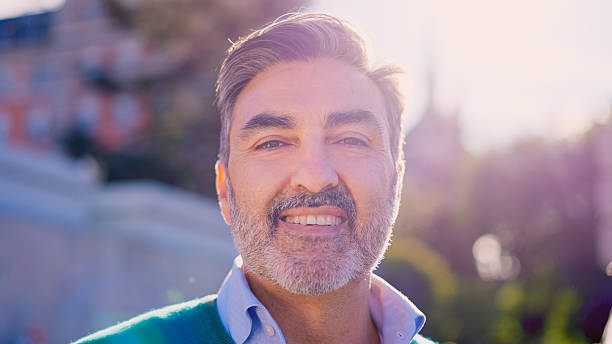 istock Mature man smiling outdoors portrait in sunlight 2249935814