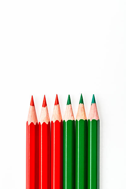 istock Six colored pencils, red and green, grouped together, isolated against a white background 2249936521