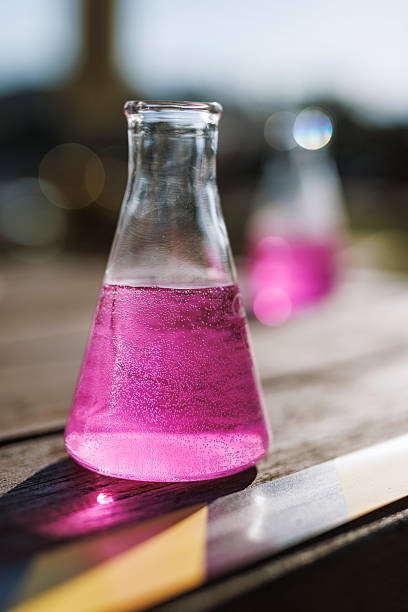 Pink sparkling drink in laboratory style glass flask
