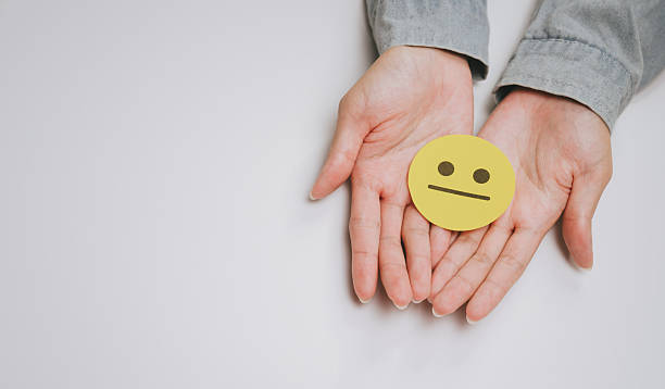 istock Neutral face hands human emotion expression yellow paper palm gesture isolated 2249940064