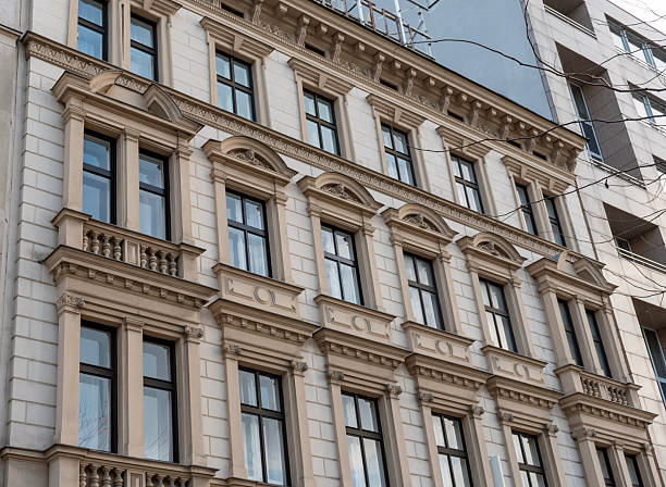 istock Facade of a historic building with decorative elements, large windows and classic architectural details in an urban environment 2249941405