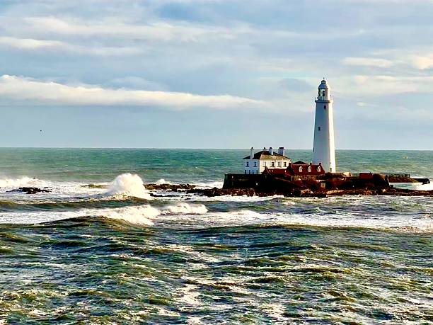 istock St Mary’s Lighthouse against an overcast sky and breaking waves 2249946936
