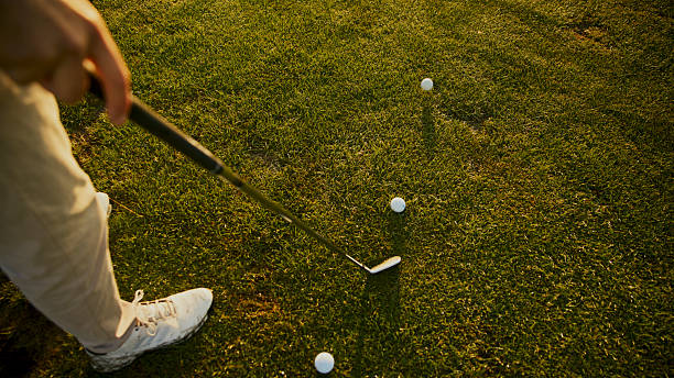 istock Golfer Preparing Practice Shots with Multiple Balls on Fairway 2249947337