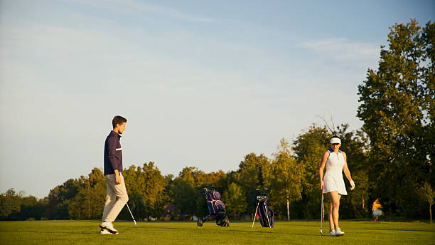 istock Caucasian Woman Engaging with Coach on Sunlit Golf Course 2249947374