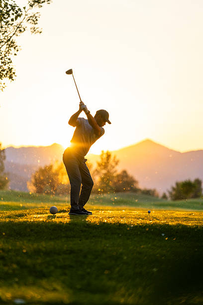 istock Caucasian Male Golfer in Action at Sunset on Golf Course Tee 2249947424