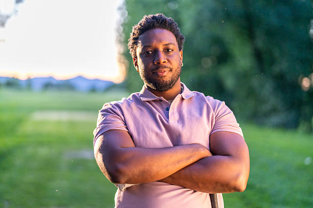 istock Confident Young Hispanic Male Golfer Standing on Green During Sunset 2249947492