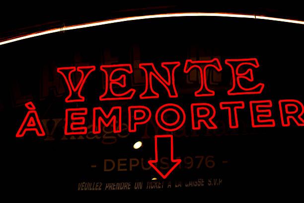 France: Neon Sign in Black Window: VENTE A EMPORTER (Take-out)