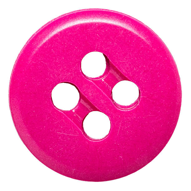 Close-up macro of one single pink plastic button isolated on white background