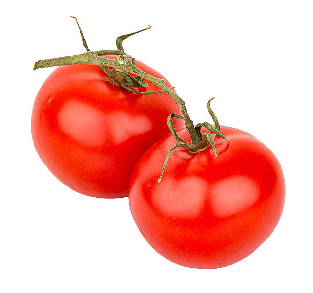 istock Red tomatoes with green stem and leaves isolated on white background 2249954990