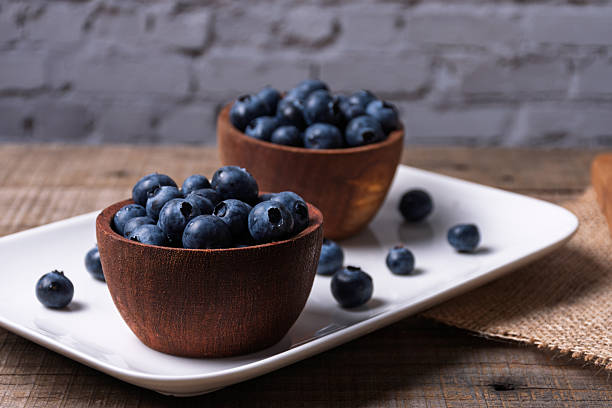 istock Rustic wooden bowls with blueberries. 2249955195