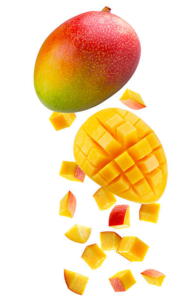 istock Whole  mango, large slice of mango cut into square pieces and individual cubic and triangular pieces fall in space. Isolated on white 2249956688