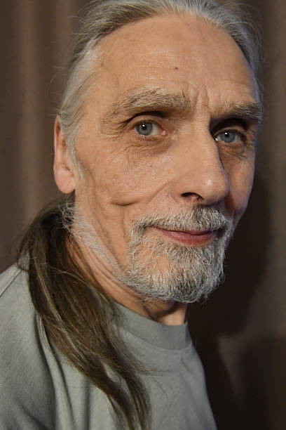 the face of an elderly man with gray hair