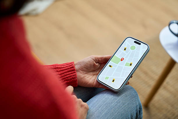 istock Person using a mobile application to find taxi service on a map 2249958160