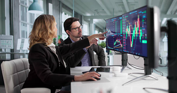 istock Male Financial Agent Trading On Multiple Screens 2249959090