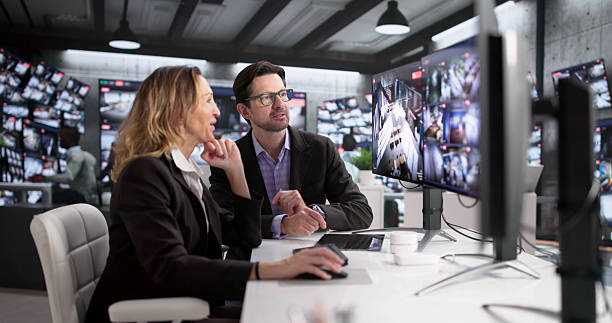 istock Security Guard And Operator Monitoring Surveillance Footage 2249959092
