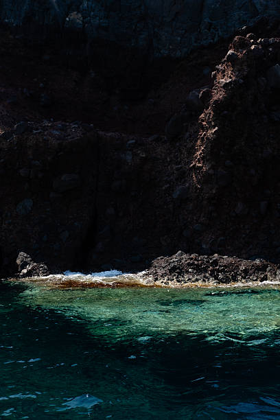 Black volcanic rocks that built the Ustica island coast