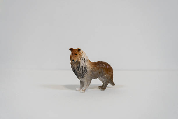 istock Miniature Collie Dog Figurine on White Background 2249968013