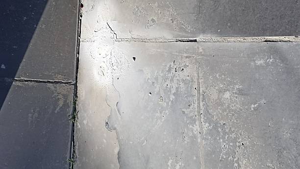 istock Weathered Stone Pavement Texture with Cracks and Imperfections for Urban Design Use 2249970389