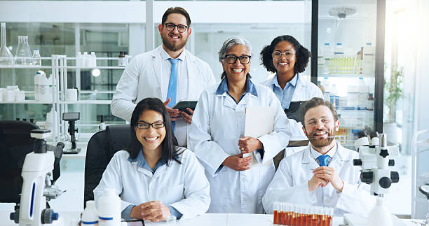 istock Science, portrait and team in lab with smile, pride or experience in genetic engineering. Medical, collaboration or biotechnologist in clinic with confidence, about us or group work in pathogen study 2249973102