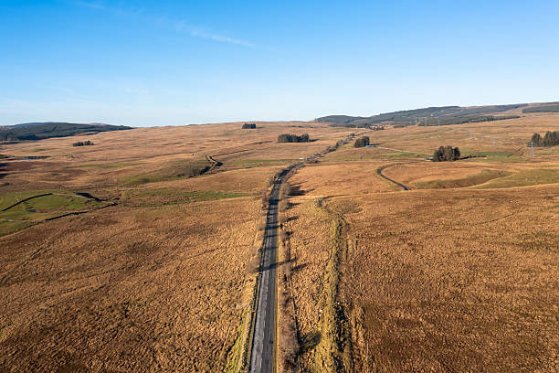 istock Drone view of a road in a remote rural location 2249974041