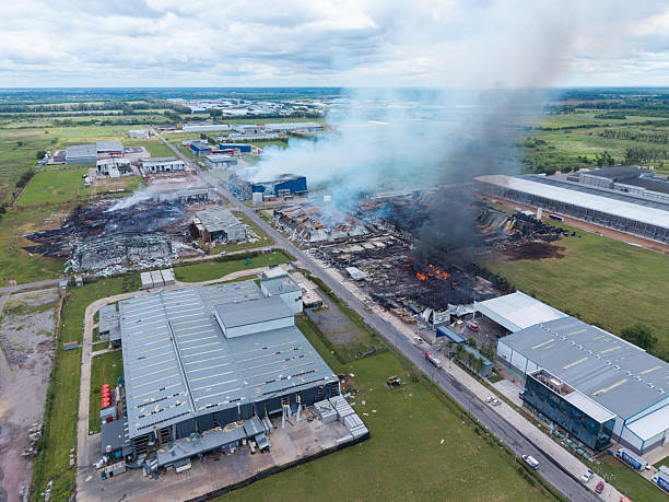 istock A large industrial area is on fire, with smoke billowing into the sky 2249974858