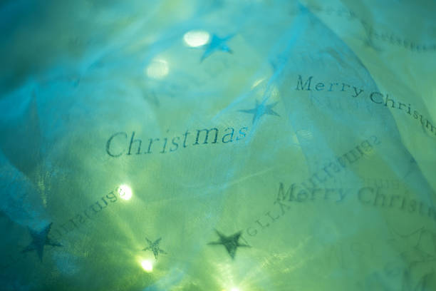 Golden glitter star symbolizing 2026 on a vibrant red background with festive bokeh lights, creating a celebratory and elegant still life for New Year-themed designs, holiday greeting cards, or seasonal promotional visuals.