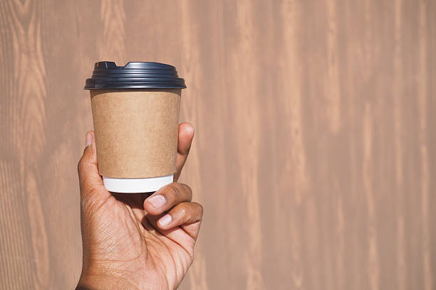istock Enjoying coffee on a sunny day with a paper cup 2249978609
