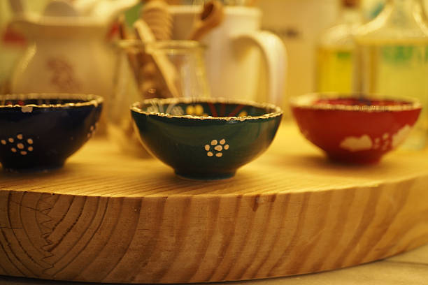 istock Colorful ceramic bowls arranged on a wooden table 2249980901