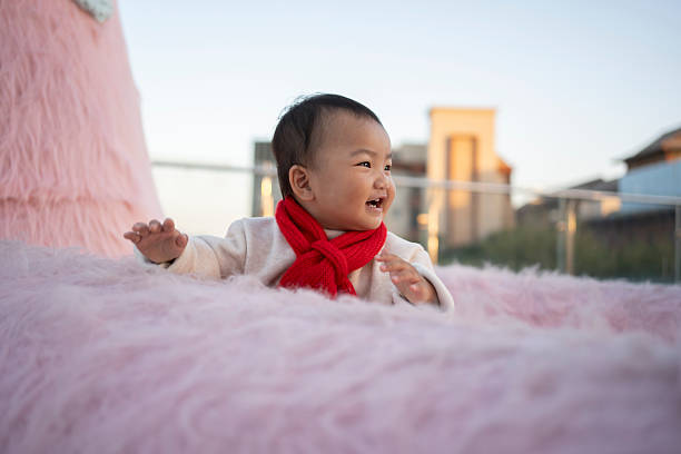 Asian babies playing and laughing happily on the terrace