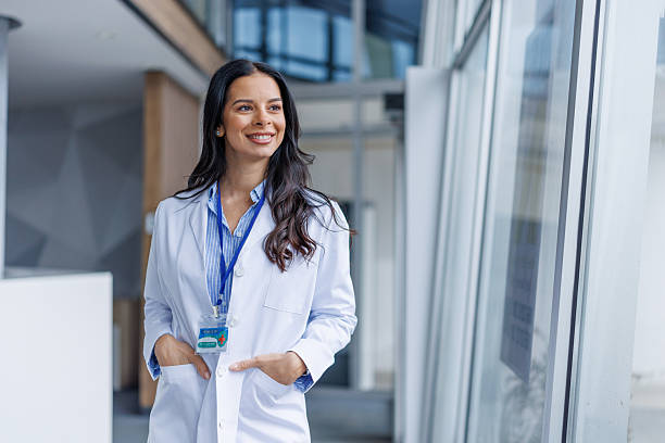 istock Female doctor smiling looking away with confidence 2249981399