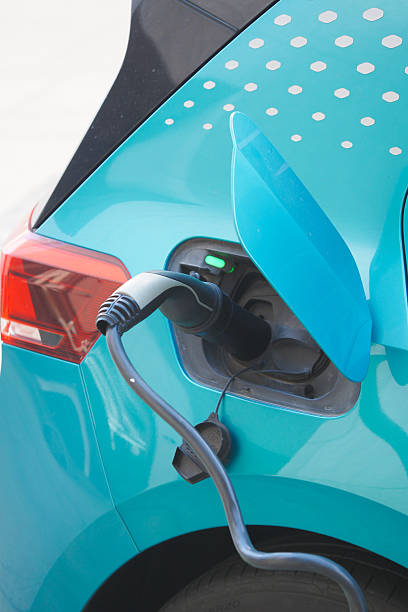 istock Electric vehicle charging at a public station in daylight 2249983529