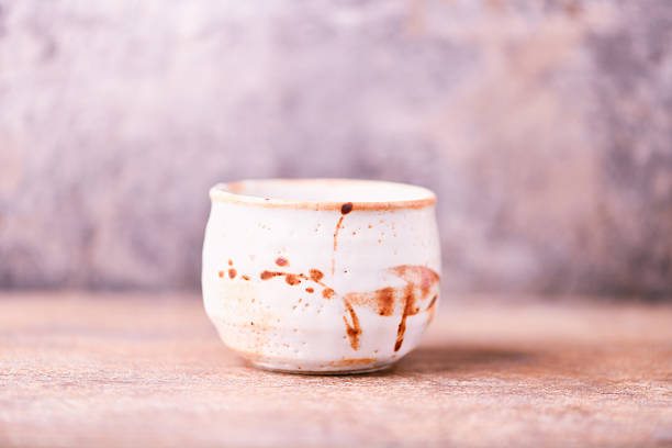 istock Traditional japanese ceramic on rustic wooden background. Soft focus. Copy space. 2249983784