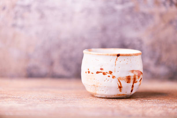 Traditional japanese ceramic on rustic wooden background. Soft focus. Copy space.