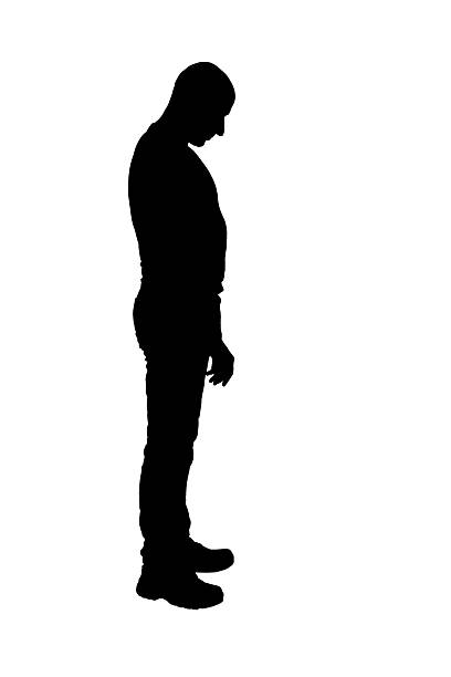 istock silhouette of  side view of a man standing looking down on white background 2249986725