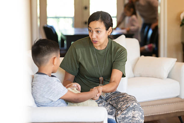 istock Mother in military uniform talks to son about returning home from deployment. 2249987278