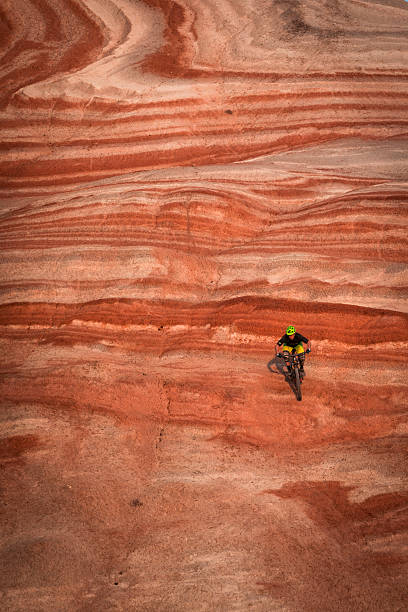 istock Mountain biker rides track on colourful mountains 2249987384