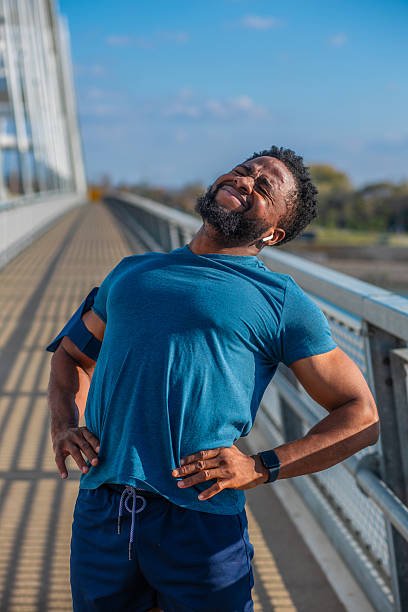 istock Fit man stretching back after workout pain 2249988117