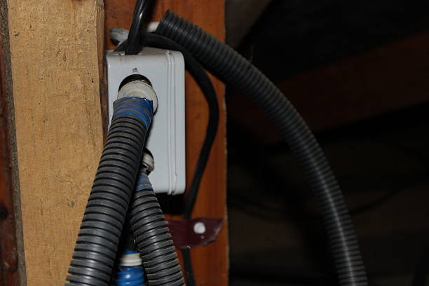 istock Electrical box and wires connected to the wall in a building during renovation process in the attic area 2249992234