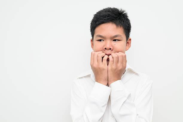 istock Asian Teenage Boy Student Studio Portrait on White Background Scared Afraid Fearful Expression 2249993480