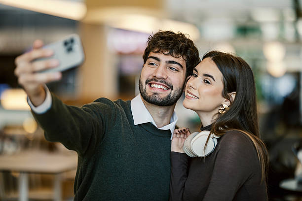 istock Happy young couple taking selfie with smartphone 2249994812
