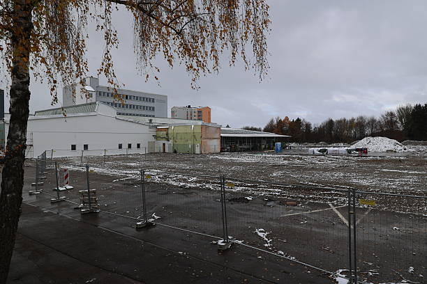 istock Large building with a fence around it 2249996997
