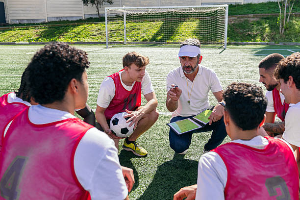 istock Soccer coach explaining strategy to young players 2249998261