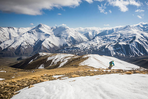 istock Mountain biker rides down alpine slopes, Greater Caucasus Mountains 2250000248