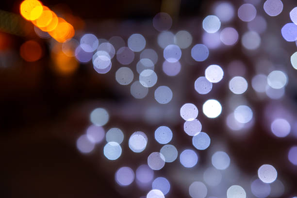 istock A mesmerizing bokeh effect with golden and multicolored lights on a dark background, ideal for holiday or dreamy compositions with a glow. 2250000575