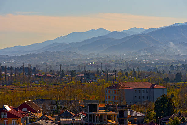 Batumi, Arjara, Georgia, Saqartvelo - Sunny Town View with Misty Snow-Capped Mountains Background