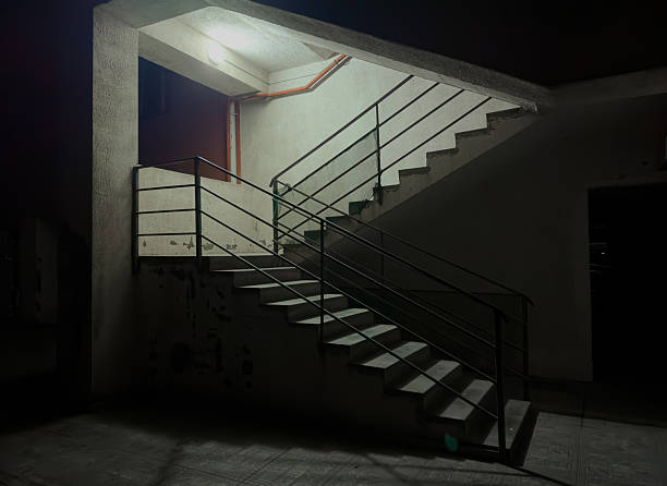Batumi, Arjara, Georgia, Saqartvelo - Dimly Lit Concrete Staircase at Night with Dramatic Shadows