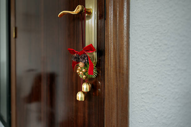 Green Christmas ornament with ball, bow and small gifts  on a wall background, xmas decoration