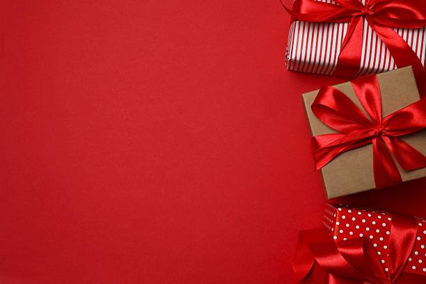 istock Beautiful gift boxes on color background 2250010178